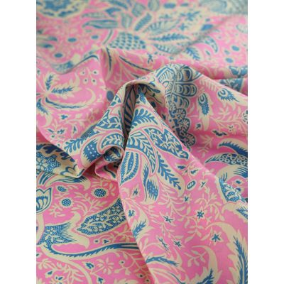 Close-up of Kaffe Fassett X William Morris Cotton Lawn Fabric – Indian Opera, featuring an intricate floral pattern in rich pink and blue tones on finely woven cotton lawn.